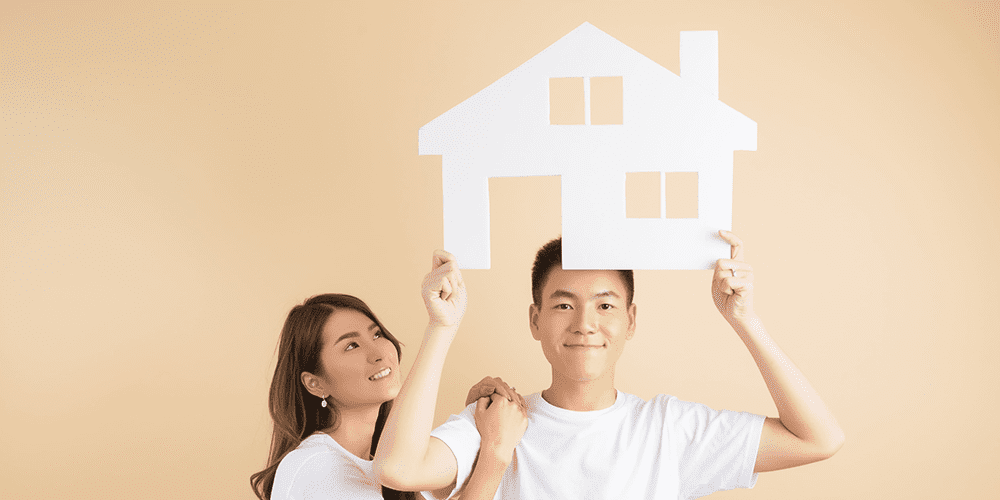 young-happy-asian-couple-presenting-symbols-house